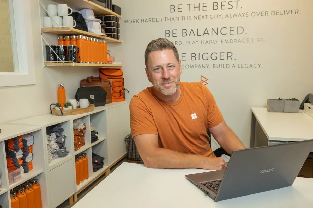 Dave Browne at his desk in the Browne Mortgage office