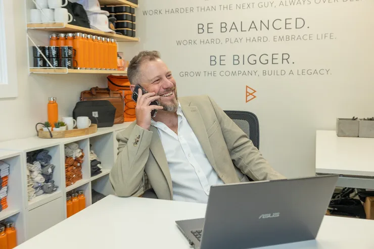 Jordi Browne taking a client call at his desk