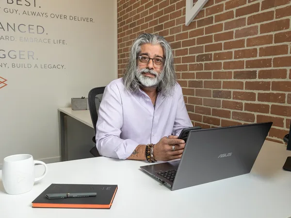 Dave Saran, licensed mortgage broker, at his desk at Browne Mortgage